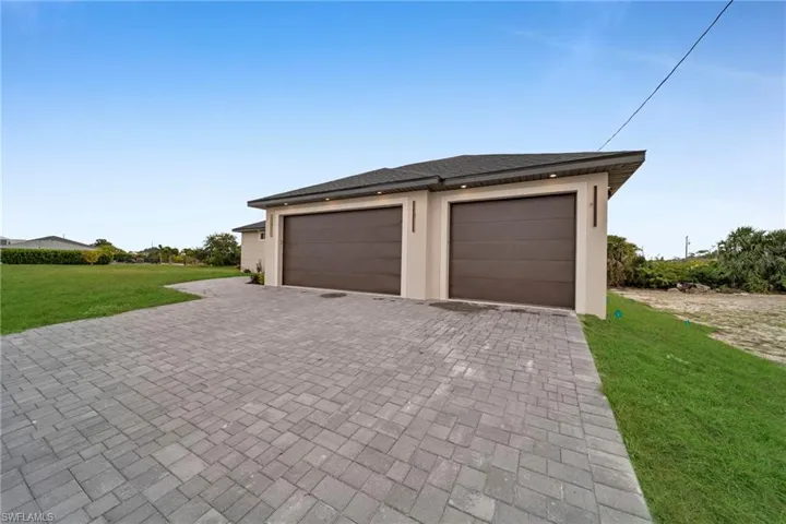 Garage with decorative driveway
