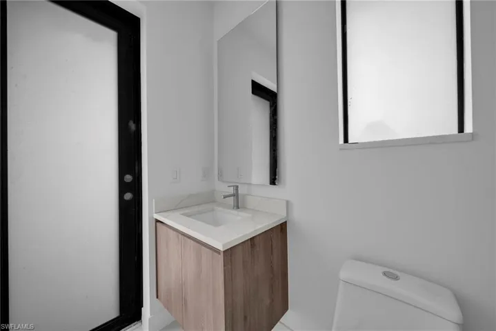 Bathroom with vanity and toilet