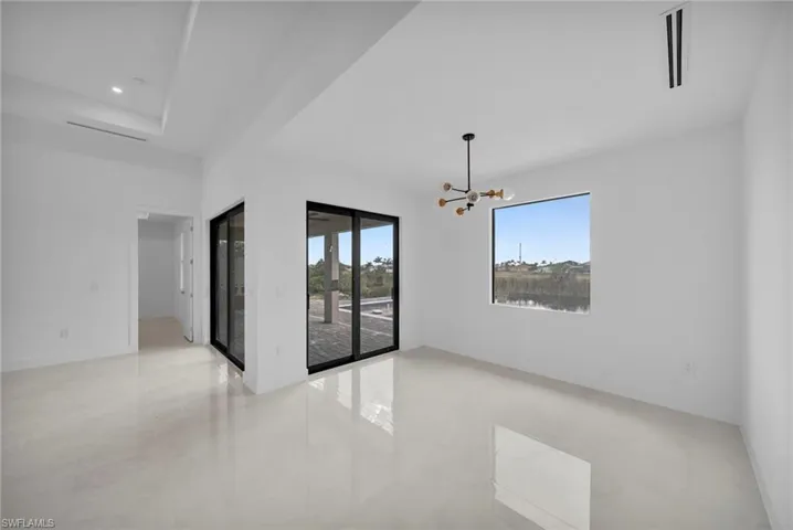 Spare room featuring a chandelier