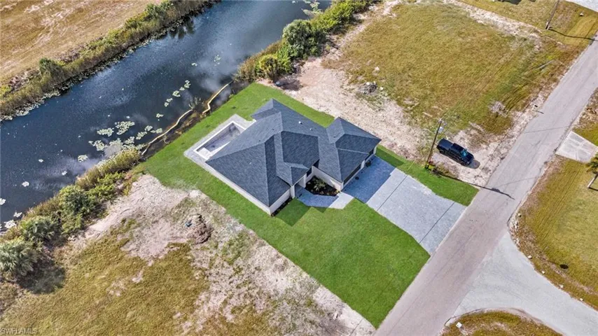 View of subject property featuring a large body of water
