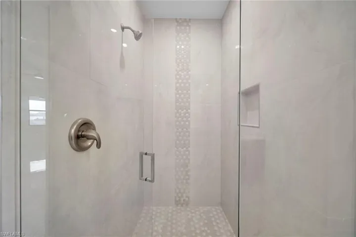 Bathroom featuring a shower stall