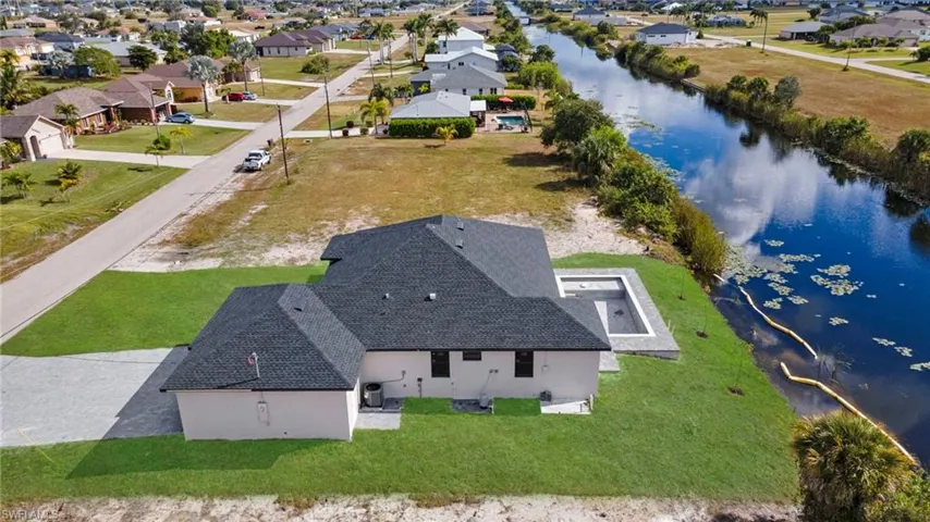 Aerial view of residential area with a large body of water