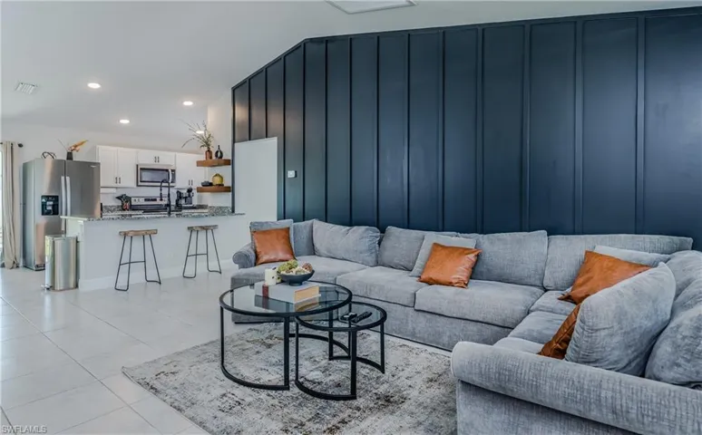 Living room featuring light tile floors