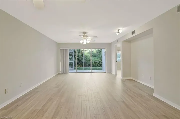 Unfurnished room with light wood-style floors and a ceiling fan