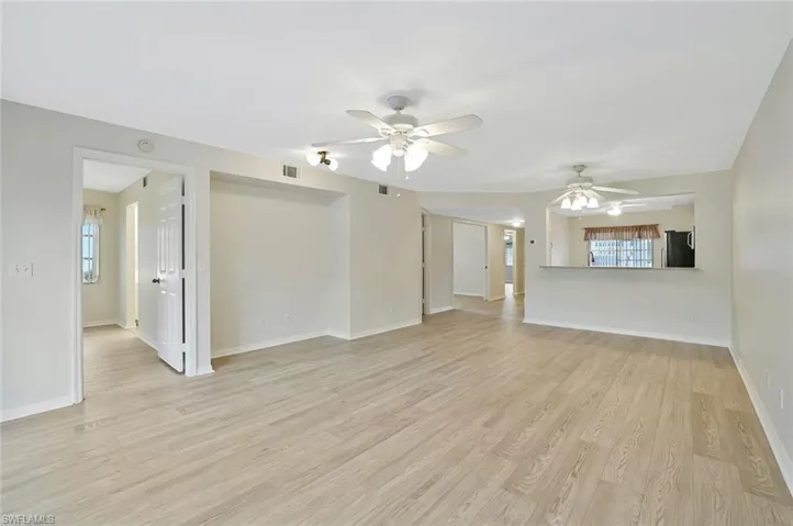 Spare room featuring light wood finished floors and ceiling fan