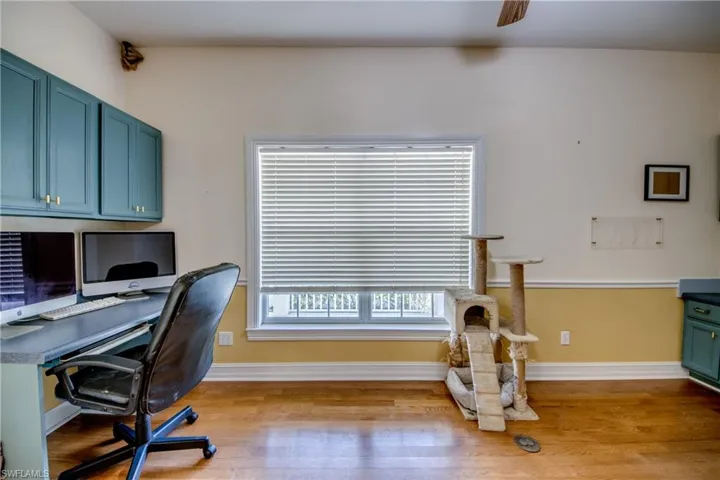 Office area with wood finished floors and baseboards
