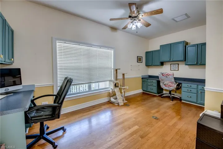 Office space featuring ceiling fan and light wood-style flooring