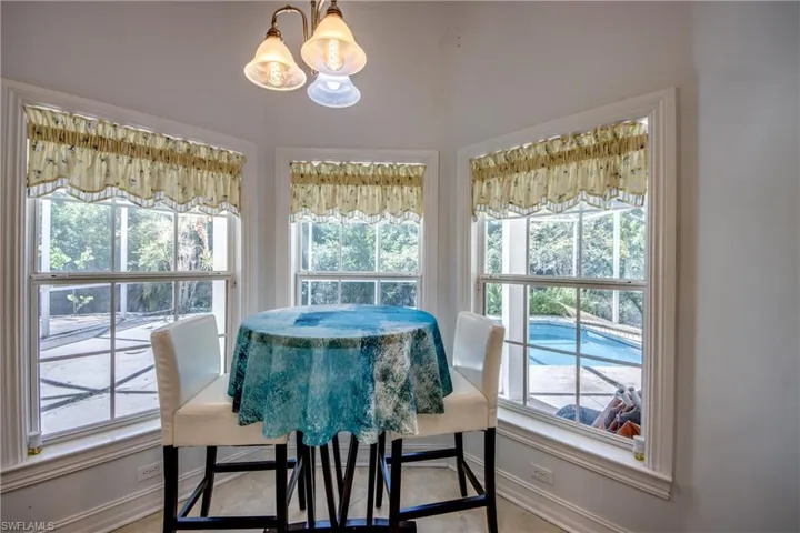 Dining room featuring a chandelier and healthy amount of natural light