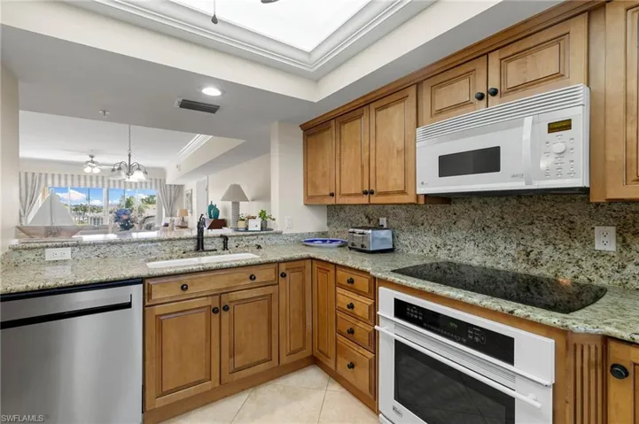 Granite extends up to backsplash for a sleek finish