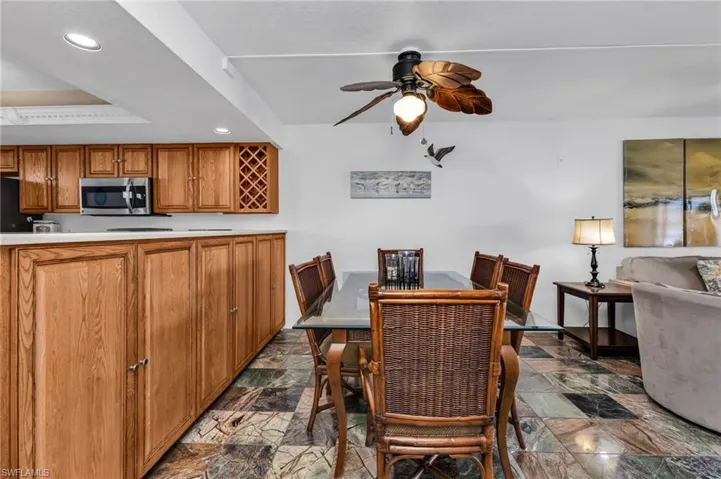 Dining area featuring extra 42" tall wood storage cabinets