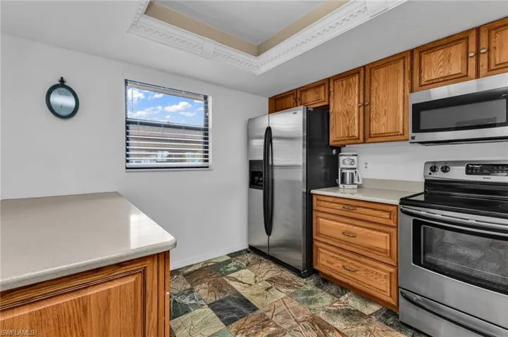 Kitchen with stainless steel appliances and ample quality wood cabinetry