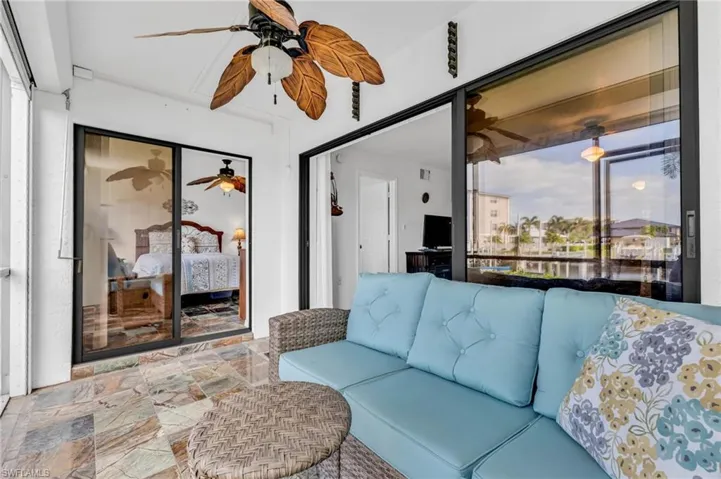 Screened lanai with view of boat dock and evening sunsets