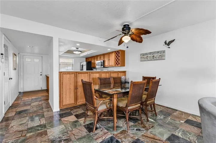 Dining area featuring extra 42" tall wood storage cabinets