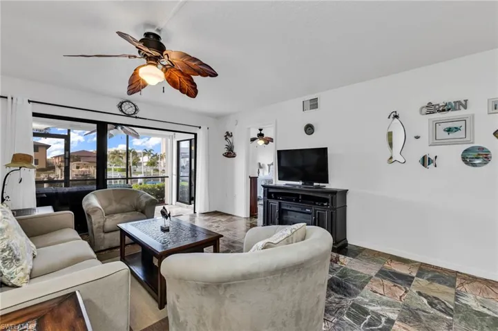 Living room with slider access to screened lanai