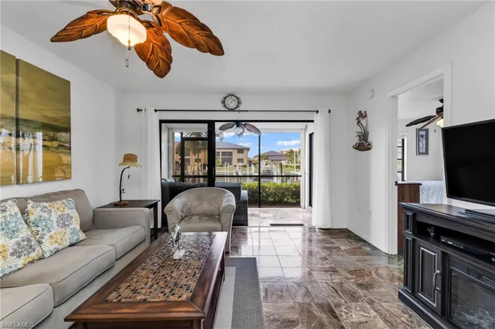 Living room with slider access to screened lanai