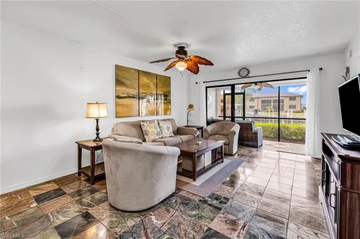Living room with slider access to screened lanai