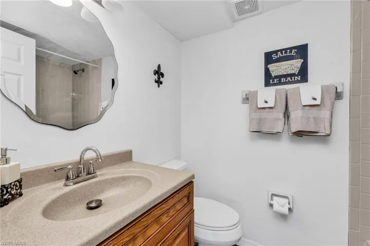Guest bathroom featuring tile shower / bath combo