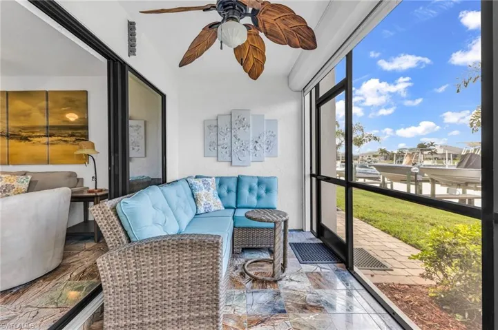 Screened lanai with view of boat dock and evening sunsets