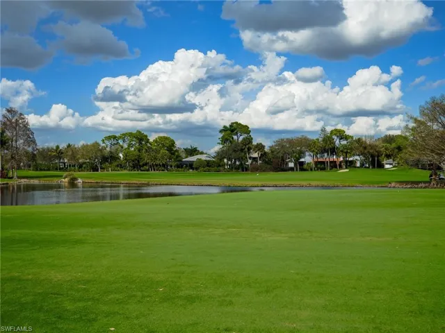 Surrounding community with golf course view and a water view