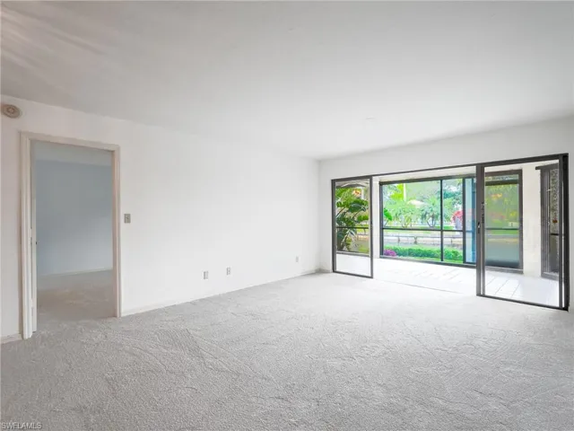 Empty room featuring carpet floors