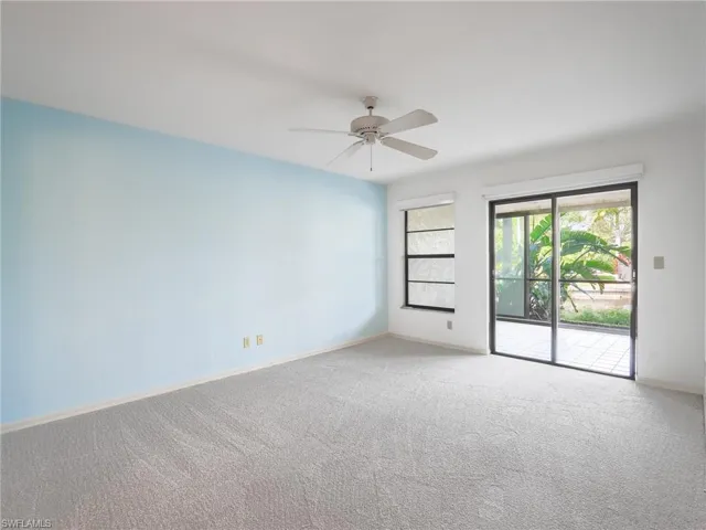 Unfurnished room with carpet and ceiling fan