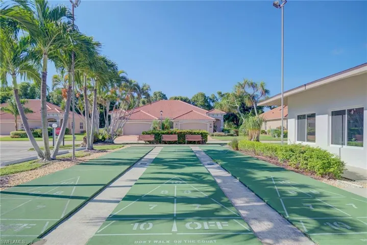 View of property's community featuring a residential view and shuffleboard