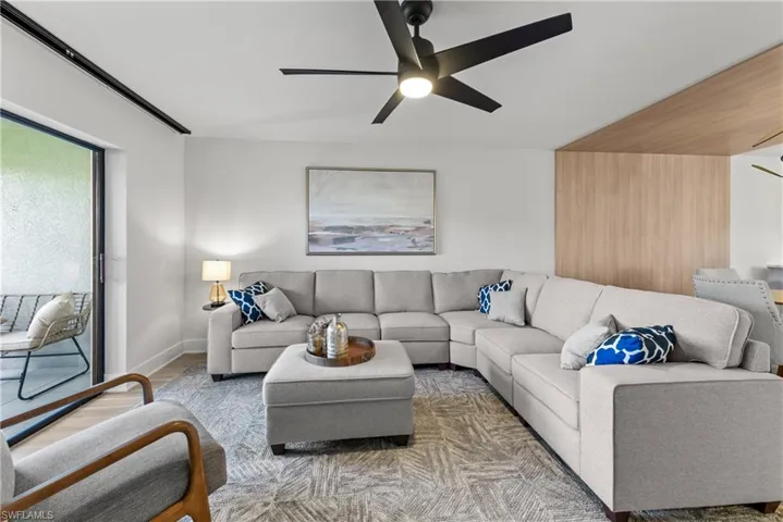 Living room featuring ceiling fan