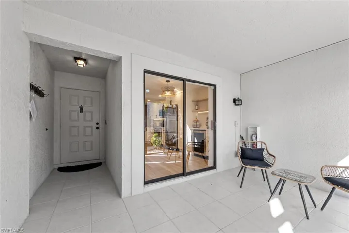 Property entrance featuring stucco siding