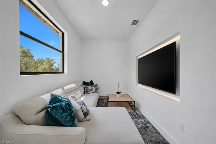 Recessed entertainment wall with integrated lighting
