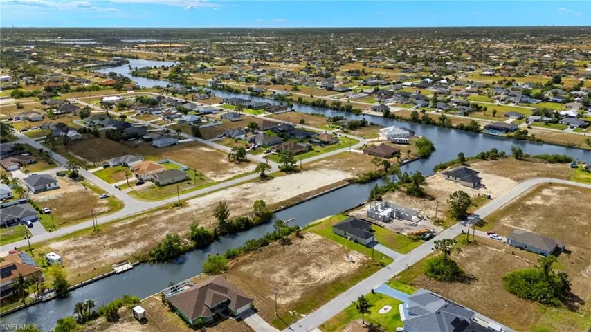 Aerial view of residential area with a nearby body of water
