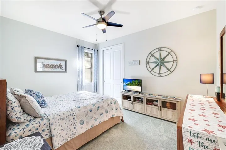 Bedroom with carpet flooring and ceiling fan