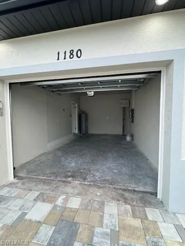 Garage featuring water heater