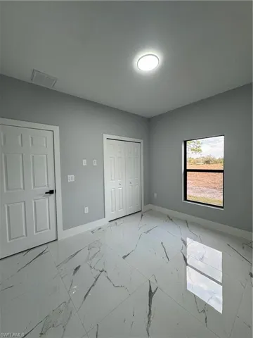 Unfurnished bedroom with a closet