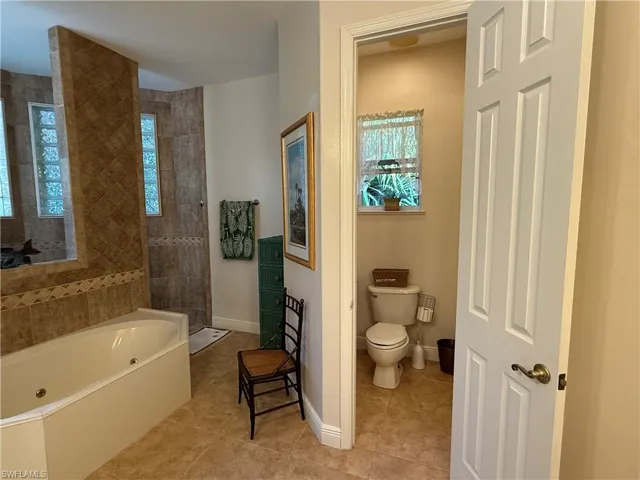Bathroom featuring a tile shower