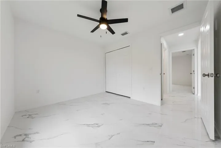 Unfurnished room with ceiling fan