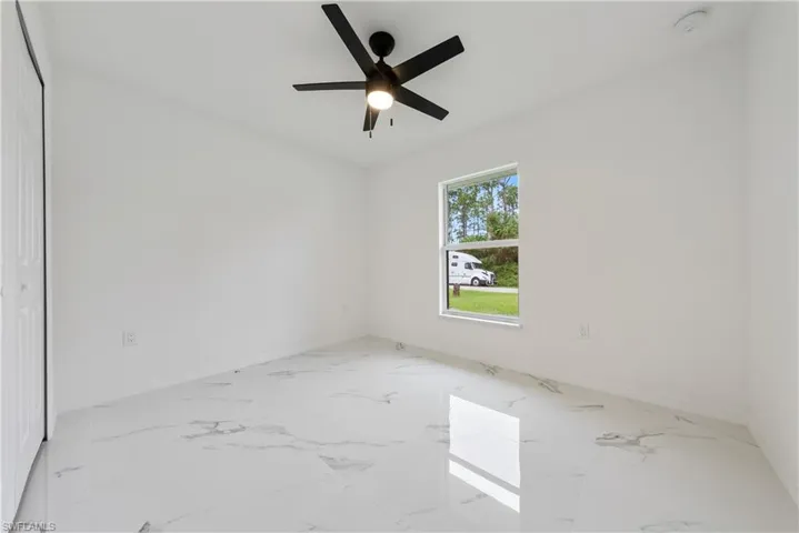 Spare room featuring ceiling fan