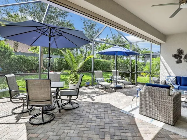 Huge, screened, SOUTH-facing outdoor lanai with patio furniture included