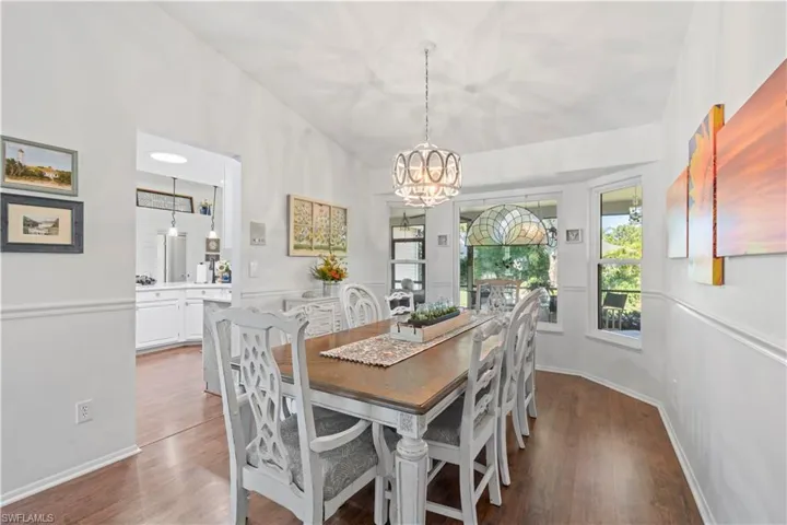 Dining space with a chandelier and wood finished floors