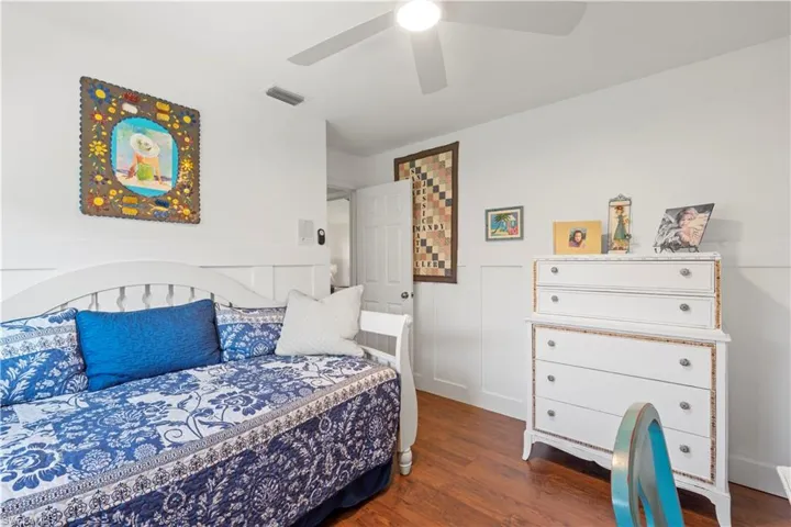 Bedroom featuring wood finished floors and a ceiling fan