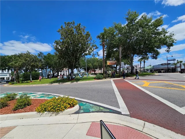 View of asphalt street with curbs and sidewalks