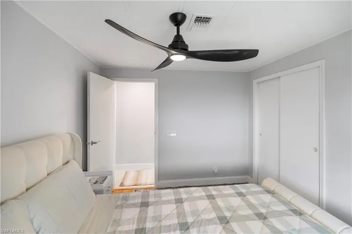Recessed lighting and ceiling fan overhead provide illumination