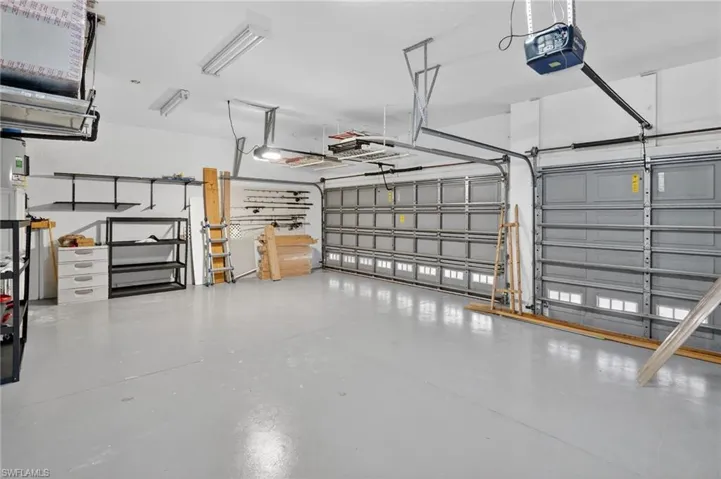 Garage featuring a garage door opener