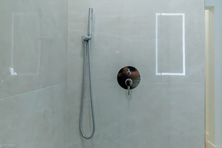 Room details with tiled shower