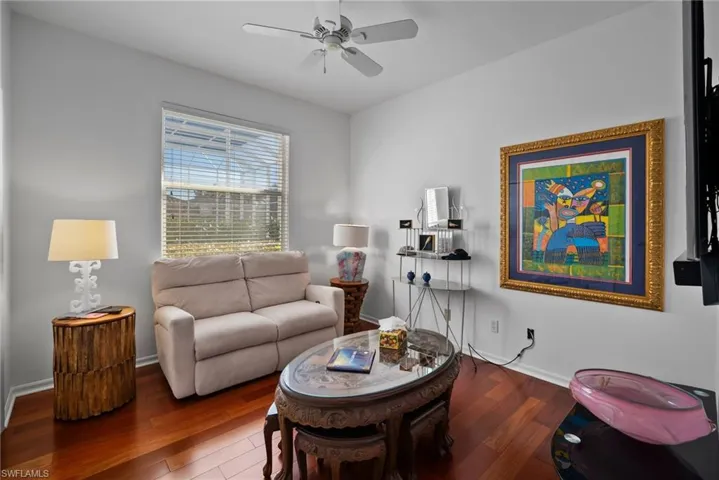 Living room featuring hardwood / wood-style floors and ceiling fan