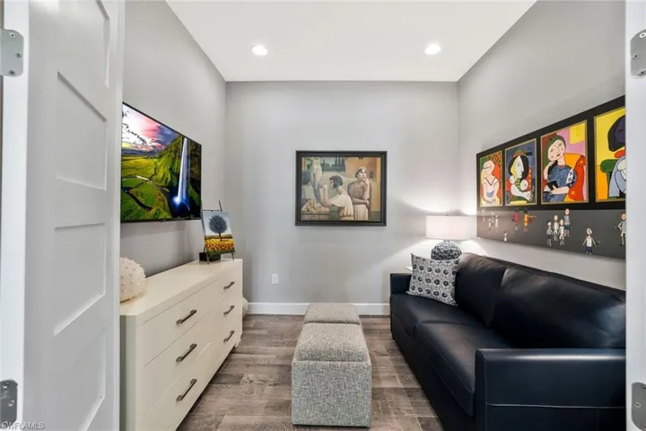 Living area featuring light wood-type flooring and recessed lighting