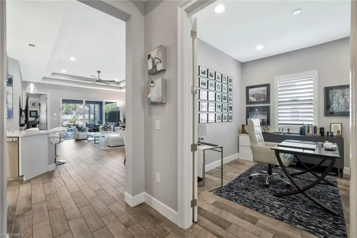 Office space featuring wood finish floors, recessed lighting, and a ceiling fan