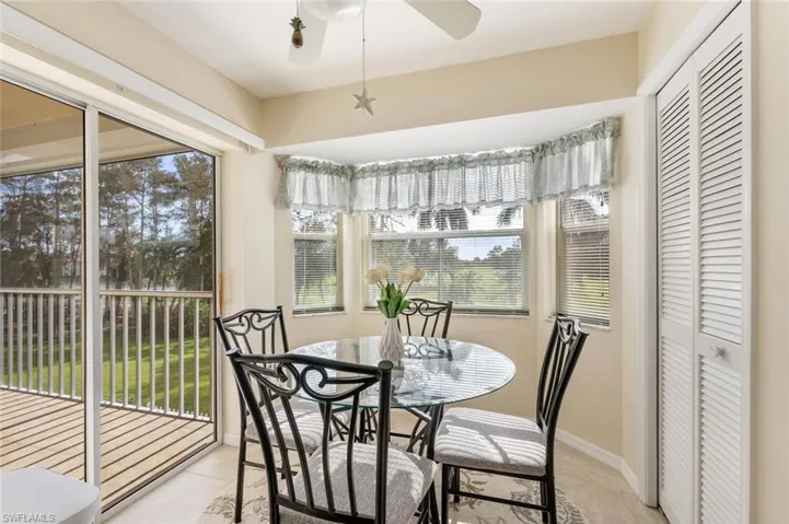 Sunroom featuring ceiling fan and a healthy amount of sunlight