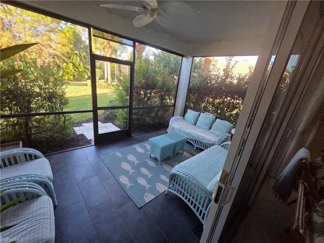 Sunroom / solarium with ceiling fan and outdoor lounge area