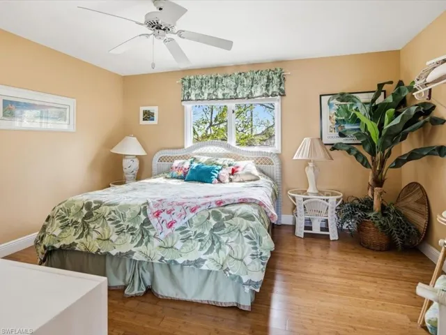 Bedroom featuring wood finished floors and ceiling fan
