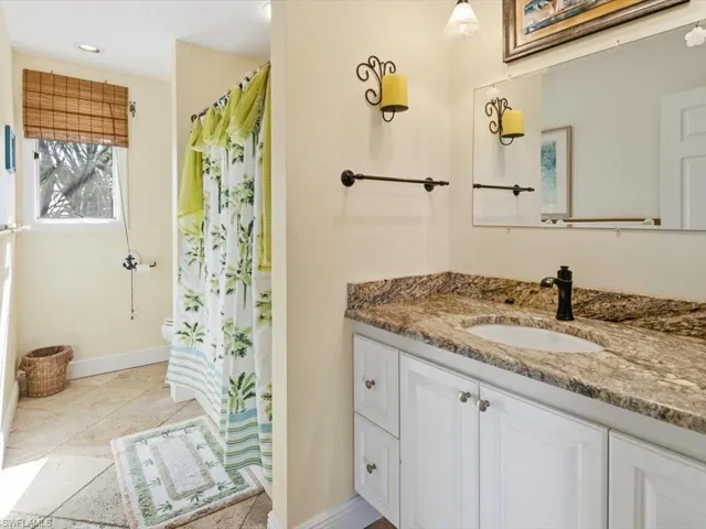 Bathroom featuring vanity and a shower with curtain